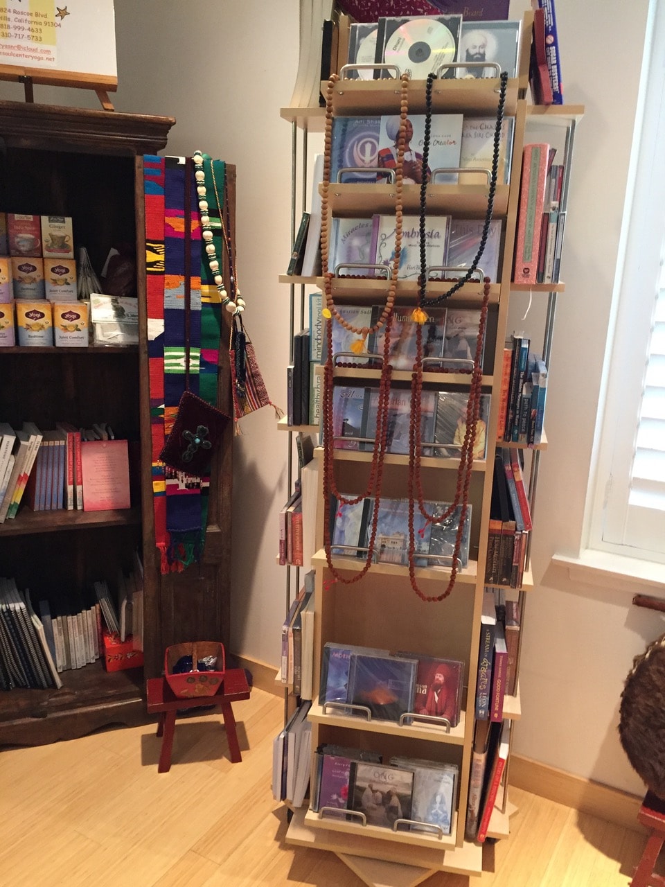 Mala beads, yoga books, and wellness items at The Soul Center Yoga