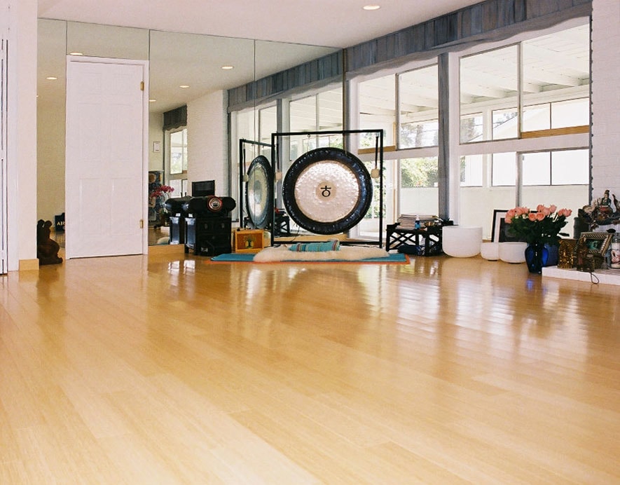 Yoga practitioner meditating in a bright studio